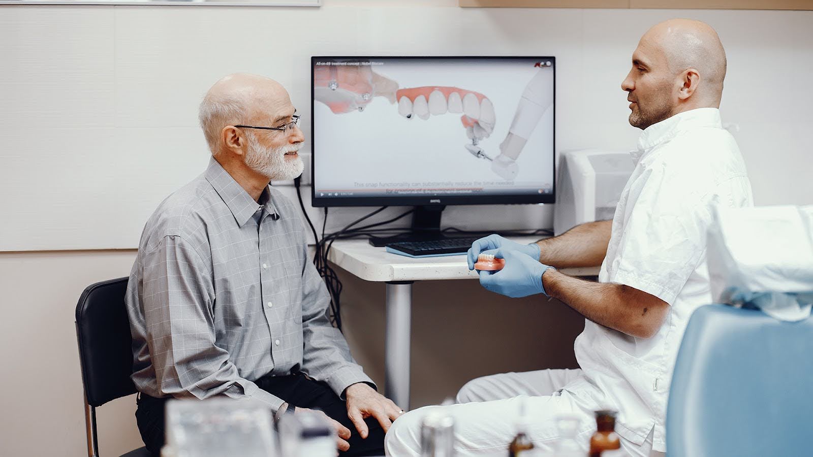 Old Patient talking to the dentist